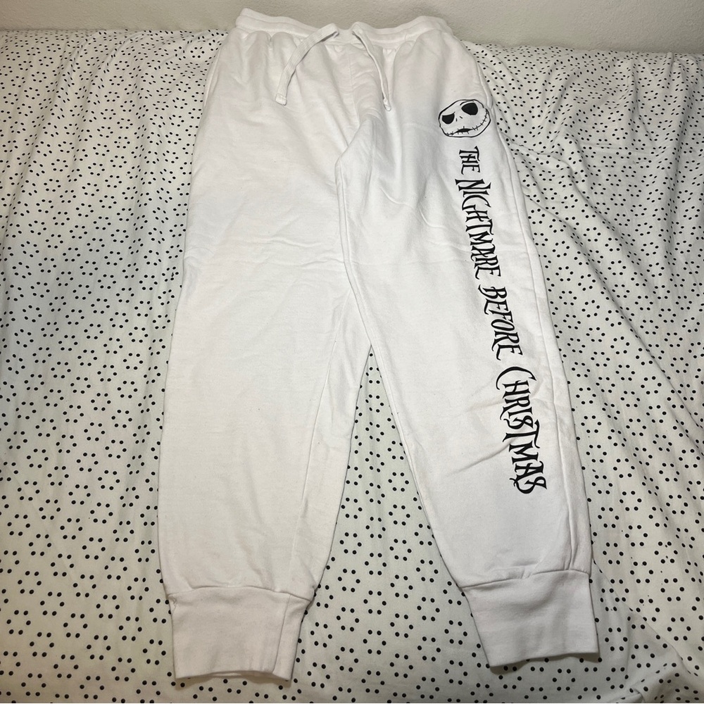 White sweatpants with The Night Before Christmas ontheleft with jackskellington.